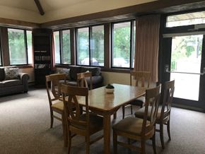 Manitowoc apartment for rent - a dining room with a wooden table and chairs