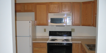 Cross Plains apartment for rent - a kitchen with a stove microwave and refrigerator