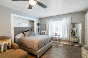 Los Angeles apartment for rent - a bedroom with a large bed and a ceiling fan