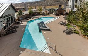 Littleton apartment for rent - A large outdoor swimming pool with a slide.