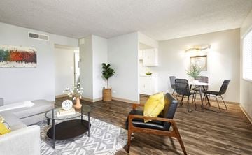 Littleton apartment for rent - a living room and dining room with a table and chairs