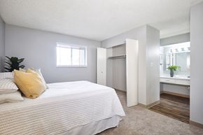 Littleton apartment for rent - a bedroom with a bed and a bathroom with a sink