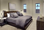 Atlanta apartment for rent - a bedroom with a bed and a dresser and a window