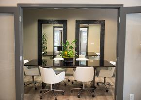 Folsom apartment for rent - a conference room with a table with chairs and mirrors
