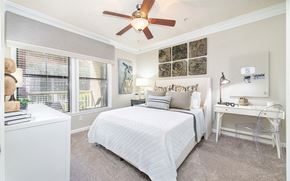 Atlanta apartment for rent - a bedroom with a large bed and a ceiling fan