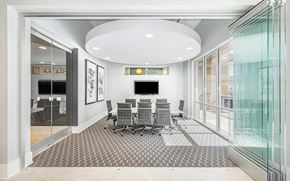 Atlanta apartment for rent - a conference room with a table and chairs and a large window