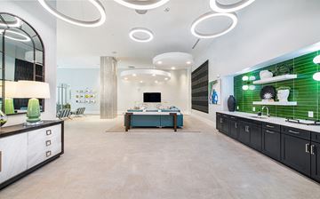 Atlanta apartment for rent - a large living room with green tiles and a table with a couch
