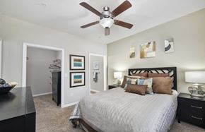 Marietta apartment for rent - a bedroom with a ceiling fan and a bed