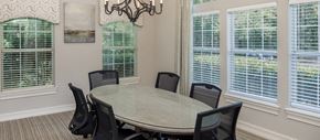 Marietta apartment for rent - a dining room with a table and chairs and windows