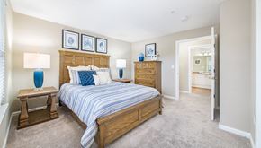 Duluth apartment for rent - a bedroom with a bed and a closet