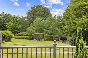 Duluth apartment for rent - A backyard with a fence and a gazebo.
