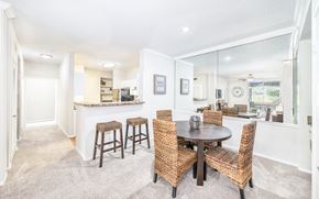 Duluth apartment for rent - a dining room with a table and chairs and a kitchen