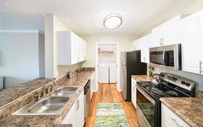 Sandy Springs apartment for rent - a kitchen with stainless steel appliances and marble counter tops