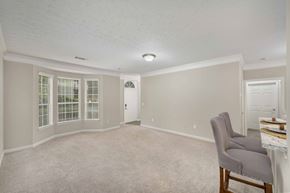 Duluth apartment for rent - an empty living room with a chair and a table