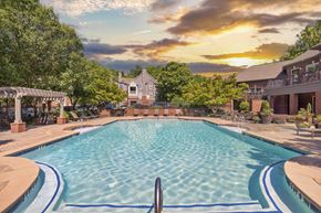 Kennesaw apartment for rent - a swimming pool with a sunset in the background