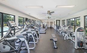 Atlanta apartment for rent - a gym with cardio equipment and windows