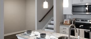 Atlanta apartment for rent - a kitchen with granite counter tops and a sink and a stove