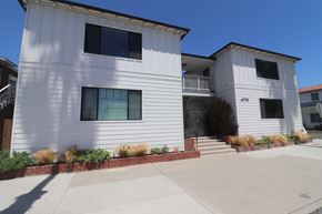 Long Beach apartment for rent - a white house with a blue sky in the background