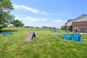 Bargersville apartment for rent - Private fenced-in dog park with play structures and bench