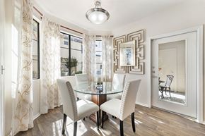 Gilbert apartment for rent - a dining room with white chairs and a glass table