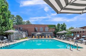 Porterdale apartment for rent - A large swimming pool with a mural on the wall behind it.
