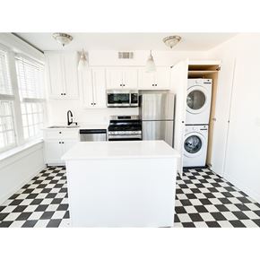 Nashville apartment for rent - A black and white checkered floor in a white kitchen.
