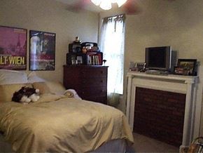 Nashville apartment for rent - a bedroom with a bed and a cat laying on it