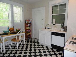 Nashville apartment for rent - a kitchen with a checkered floor and a table and chairs