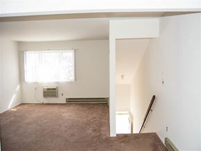 Oakdale apartment for rent - Carpeted Living Area at Brookwood at Oakdale 55+, Oakdale, NY