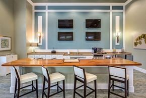 Jacksonville apartment for rent - a kitchen with a bar and a counter top with chairs