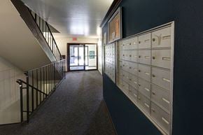Madison townhouse for rent - a hallway with a row of lockers and a staircase