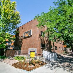 Denver apartment for rent - a brick building with a sign on the side of it
