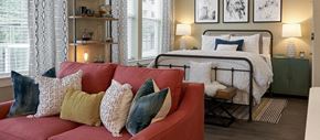 Atlanta apartment for rent - a bedroom with a bed and a couch with pillows
