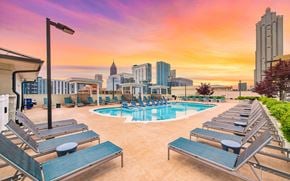 Atlanta apartment for rent - a swimming pool at a hotel with the city skyline in the background