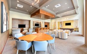 Atlanta apartment for rent - a large dining room with tables and chairs and a lobby