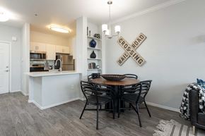 Phoenix apartment for rent - a dining room with a table and chairs and a kitchen