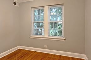 Oak Park apartment for rent - A room with a window covered in white blinds.