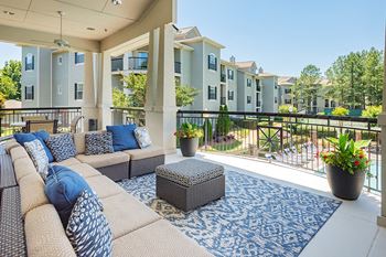 Outdoor resident lounge overlooking the pool