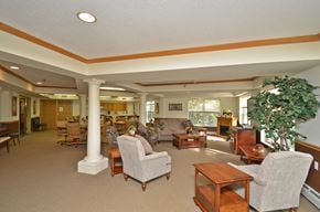 Plymouth apartment for rent - a living room filled with furniture and a large window