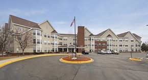 Plymouth apartment for rent - an empty parking lot in front of an apartment building
