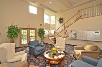 Plymouth apartment for rent - a living room with couches and chairs and a staircase