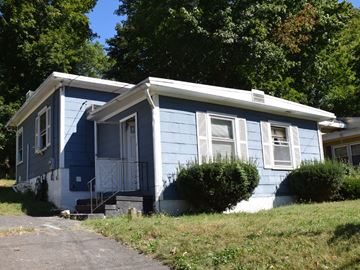 New Haven apartment for rent - A blue house with white trim and a white door.