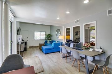 Anaheim apartment for rent - a living room and dining room with a table with a laptop