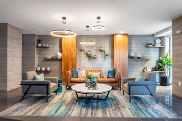 Montclair apartment for rent - a living room with couches and chairs and a table