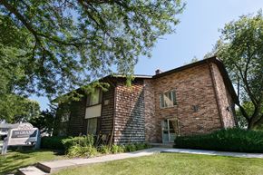 West Allis apartment for rent - an old brick building with a sign in front of it