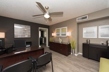 Phoenix apartment for rent - a living room with a ceiling fan and a desk