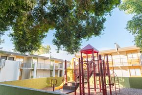 Phoenix apartment for rent - a playground at an apartment complex with a colorful play set