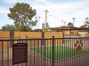 Phoenix apartment for rent - a dog park with a sign on a fence