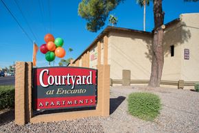 Phoenix apartment for rent - a sign for the courtyard apartments with balloons