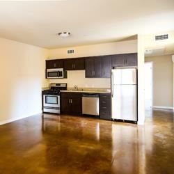 Emeryville apartment for rent - A kitchen with black cabinets and stainless steel appliances.